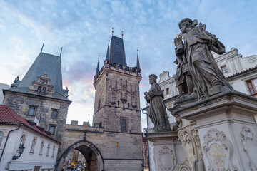 Religious statue of Vitus with Mala Strana Bridge Tower, Charles Bridge, Czech Republic