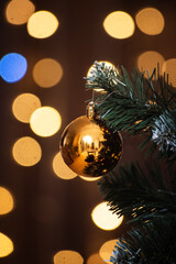 Christmas ball against a dark background with Christmas bokeh
