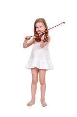 Cute little child in white dress playing the violin.
