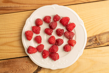 Sweet fresh raspberries, top view, macro.