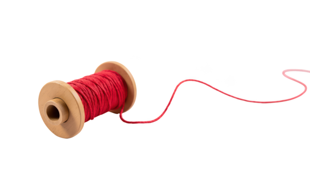 Red thread spool, sewing accessory, crafting material, wooden bobbin, textile tool, creative hobby