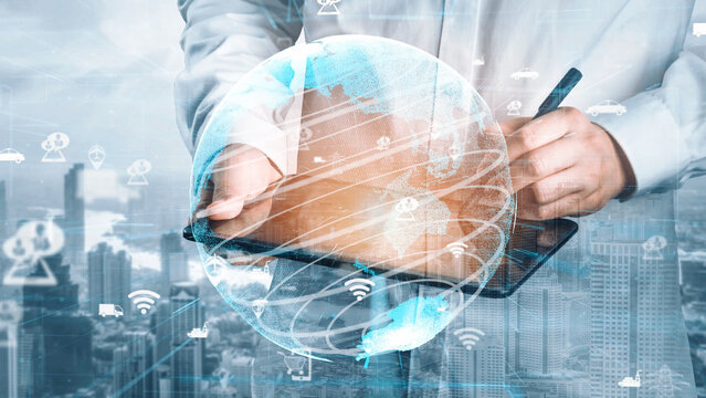 Businessman engaged in digital technology, using a tablet to access global connectivity, surrounded by concept illustrations on the urban background, symbolizing innovation. Xenic