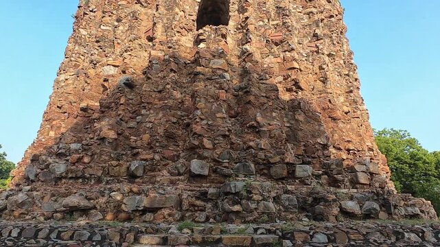 Low-Angle View of the Massive, Truncated Stone Base and Ruins of the Alai Minaret, An Unfinished Victory Tower Located in the UNESCO World Heritage Qutub Complex in Delhi.