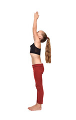 A little girl in red leggings doing yoga with both hands raised up