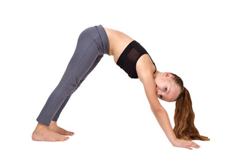 A little girl doing yoga stands with her feet and hands on the floor