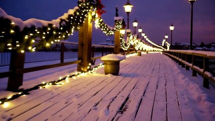 Festive snowcovered bridge illuminated by warm holiday lights at dusk - Powered by Adobe