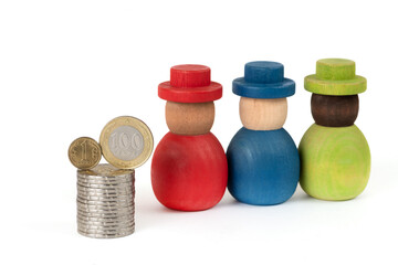 Coins of 1 and 100 Kazakhstani tenge and wooden people