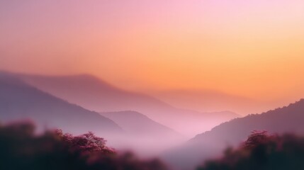 Obraz premium Serene Mountain Landscape at Sunrise with Soft Hues of Purple, Pink, and Orange in Tranquil Misty Atmosphere