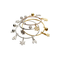Collection of delicate charm bracelets with snowflake and bell charms isolated on transparent background