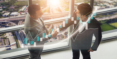 Two business professionals engage in a handshake signifying partnership and success against a...