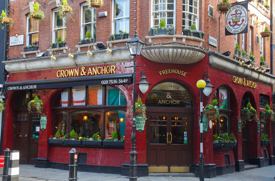 The Crown and Anchor pub historic brick building facade on a corner of Covent Garden, city of London, England.