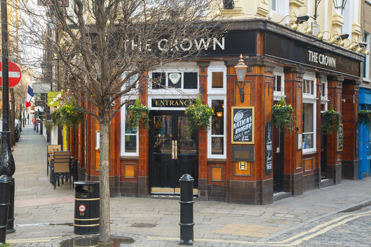 The Crown pub historic brick building facade on a corner of Covent Garden, city of London, England.