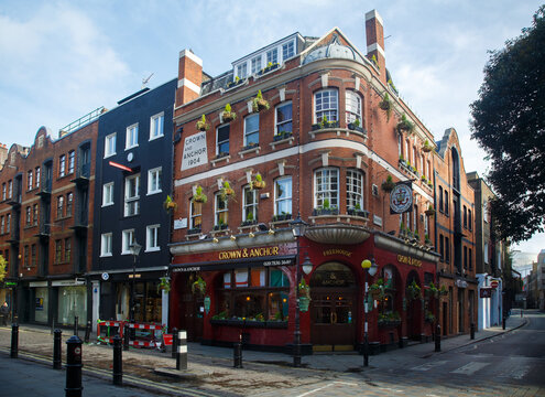 The Crown and Anchor pub historic brick building facade on a corner of Covent Garden, city of London, England.