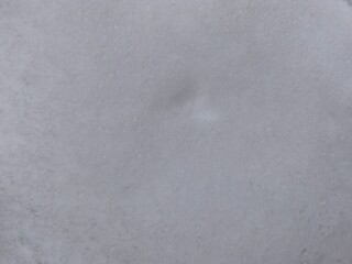 Winter texture. The surface of the snow. Winter background. A light backdrop. Top view.
