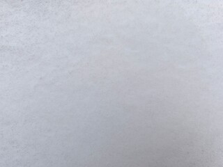 Winter texture. The surface of the snow. Winter background. A light backdrop. Top view.