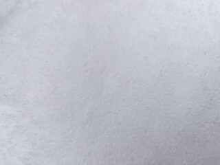 Winter texture. The surface of the snow. Winter background. A light backdrop. Top view.