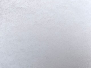 Winter texture. The surface of the snow. Winter background. A light backdrop. Top view.