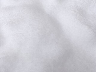 Winter texture. The surface of the snow. Winter background. A light backdrop. Top view.