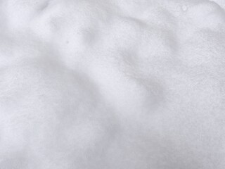 Naklejka premium Winter texture. The surface of the snow. Winter background. A light backdrop. Top view.