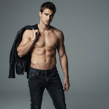 German Man Shirtless with Jacket Over Shoulder