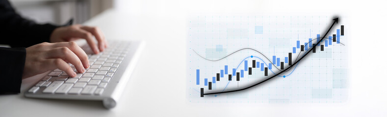 A business professional uses a keyboard to analyze data and growth trends, showcasing the importance of data-driven decision-making in modern office environments. Impute