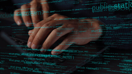 Close-up of hands typing on a keyboard surrounded by digital code, showcasing the intersection of technology and education in today innovative workspace. Xenic