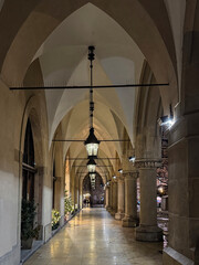 Night scene of Historic Sukiennice Cloth Hall Arcades in Old Town Krakow, Poland