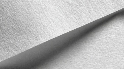 Close-up View of Textured White Paper with Soft Shadows and Subtle Grain for Artistic and Design Applications in Photography and Print