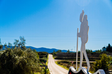 Figure of a hiker against blue sky 