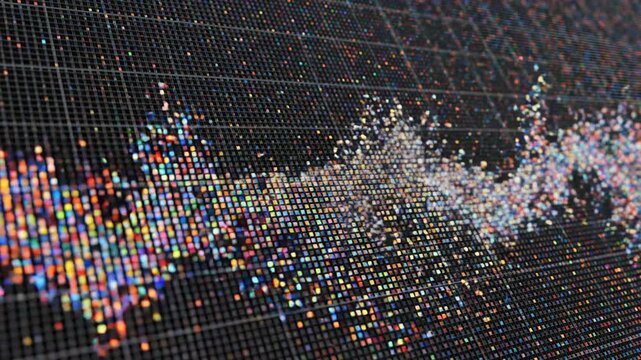 Abstract digital graphic showing downward trend chart composed of tiny colored squares on dark grid background