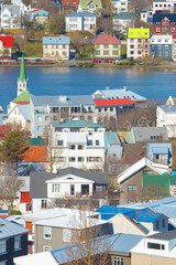 Colorful Houses and Church Spire in Reykjav&iacute;k by the sea