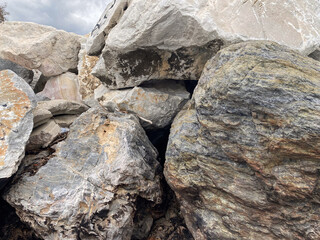 Natural rock formation with large boulders and textured surface