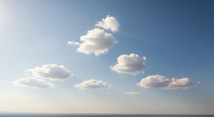 Serene Sky Scene Featuring White Cumulus Clouds Floating Against Gradient Blue Backdrop, Suggesting Tranquility and Openness on Sunny Day