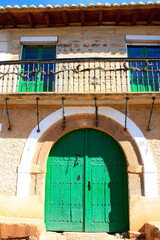 Rustic Mediterranean House with Green Door and Balcony