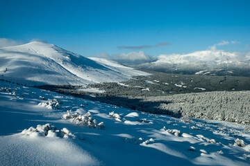 Pristine Winter Mountain Landscape with Blue Sky