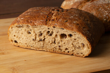 Whole grain bread on a wooden background