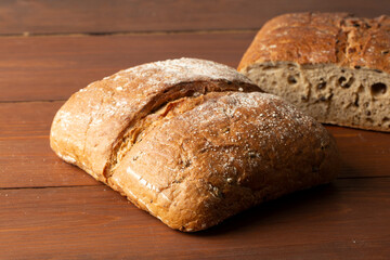 Whole grain bread on a wooden background