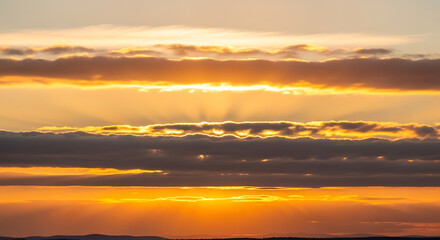Golden Hour Sky with Sun Rays Breaking Through Clouds Creating Beautiful Atmospheric Landscape at Sunset with Orange Hues 150 Characters
