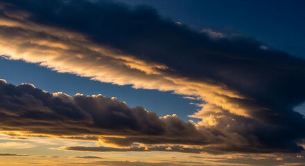 Beautiful Sky with Golden Clouds During Sunset Creating Scenic Landscape with Blue Sky Peeking Through 150 Characters