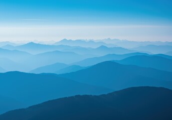 Fototapeta premium Scenic mountain range featuring hazy blue peaks stretching toward the horizon beneath a brilliant, cloudless sky ,day ,sky ,view