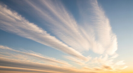 Feather Clouds Against Blue Sky Creates Striking Weather Pattern with Wispy Cirrus Formation in Sky at Sunset and Evening with Atmospheric Perspective