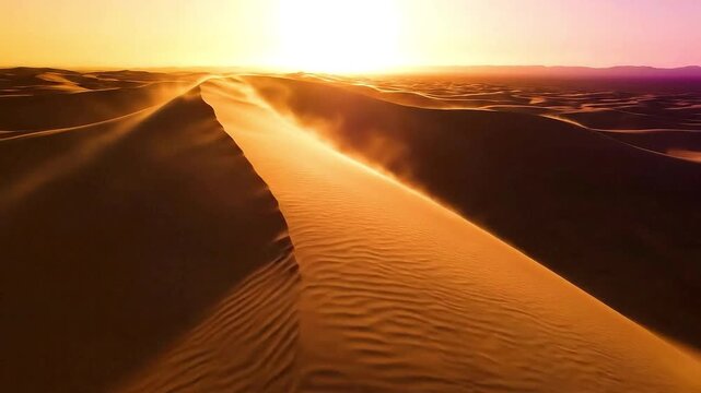 Majestic Golden Sand Dunes at Sunset with Wind Blowing Sand Across the Crest in a Hot Arid Desert Landscape