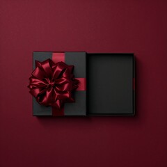 Elegant black gift box with a lush red bow, partially opened on a rich burgundy background.