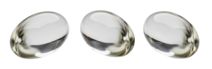 Three clear oval capsules on black background transparent background cutout png
