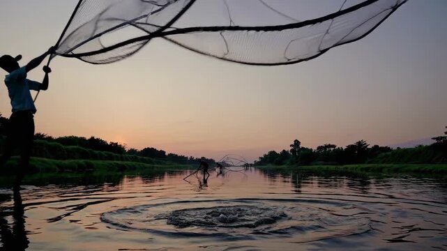 fisherman casting net into river at sunset, large net arcs over water creating ripples, silhouette against pastel sky, traditional harvest scene and calm reflection