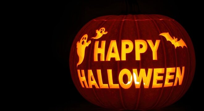 Festive carved pumpkin glowing with Happy Halloween message and spooky ghost - Powered by Adobe