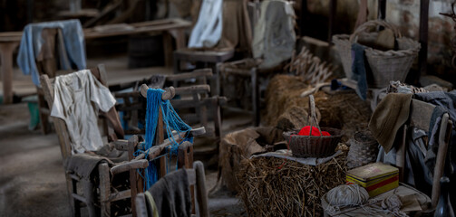 Ancient Italian Rural Farmhouse Interior with Wooden Chairs and Traditional Knitting Workspace