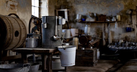 Vintage Water Containers and White Enamel Bucket in Old Italian Farmhouse Interior