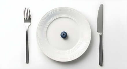 Single blueberry on white plate with fork and knife