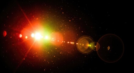 Lens flare effect with red, green, and yellow lights on a black background